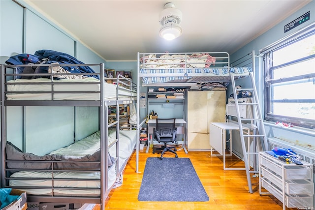 bedroom with hardwood / wood-style floors