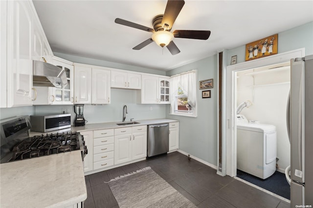 kitchen featuring sink, white cabinets, stainless steel appliances, and range hood