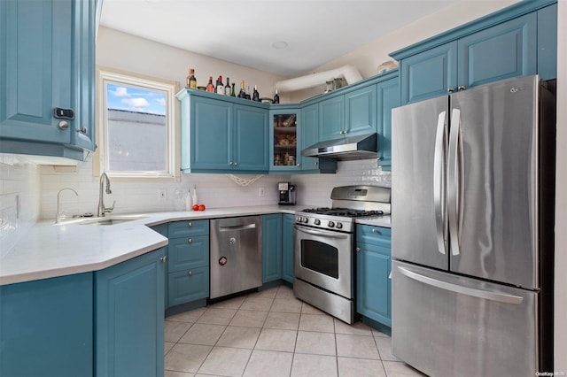 kitchen featuring sink, blue cabinetry, and appliances with stainless steel finishes