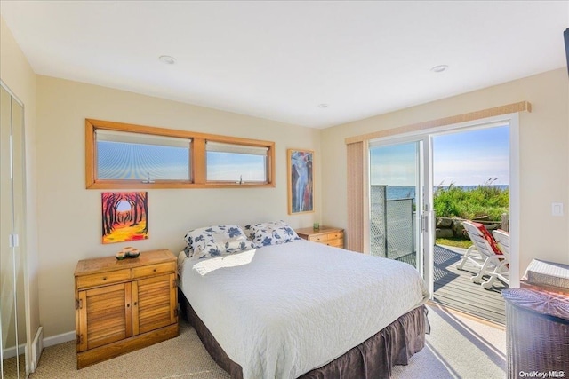 carpeted bedroom featuring access to outside