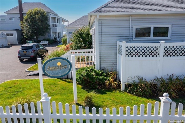 view of side of home featuring a yard