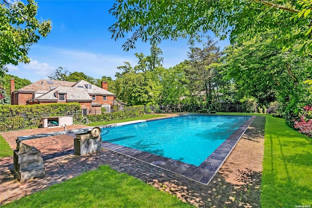 view of swimming pool with a patio