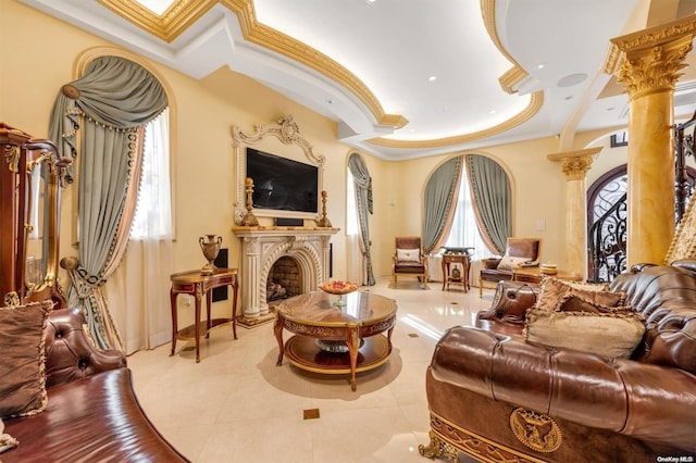 sitting room featuring decorative columns, crown molding, and light tile patterned flooring