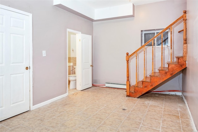 foyer with a baseboard heating unit