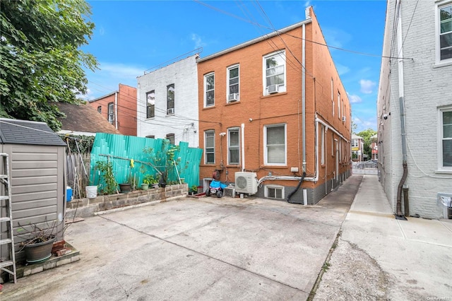 back of property featuring ac unit