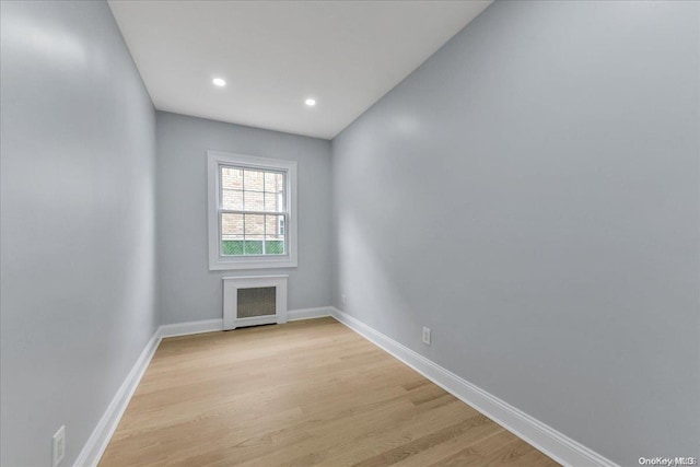 unfurnished room with light hardwood / wood-style floors