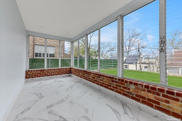 unfurnished sunroom with a healthy amount of sunlight