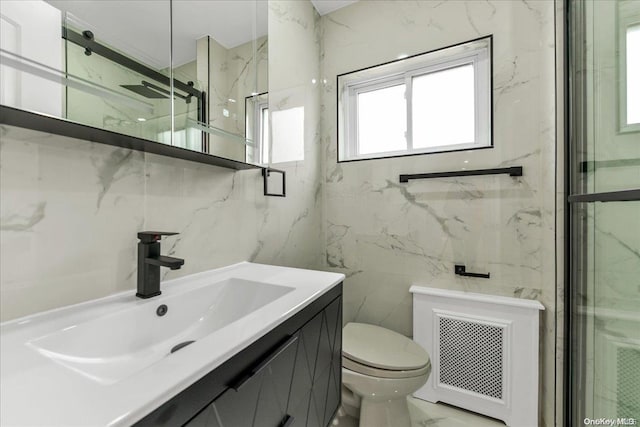 bathroom featuring an enclosed shower, vanity, toilet, and tile walls