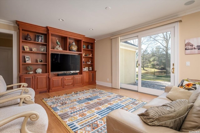 living room with crown molding and light hardwood / wood-style flooring