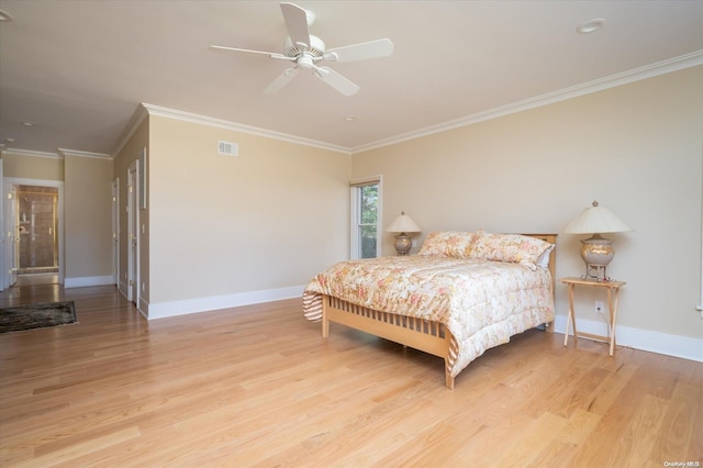 bedroom featuring ceiling fan, light wood-type flooring, and ornamental molding