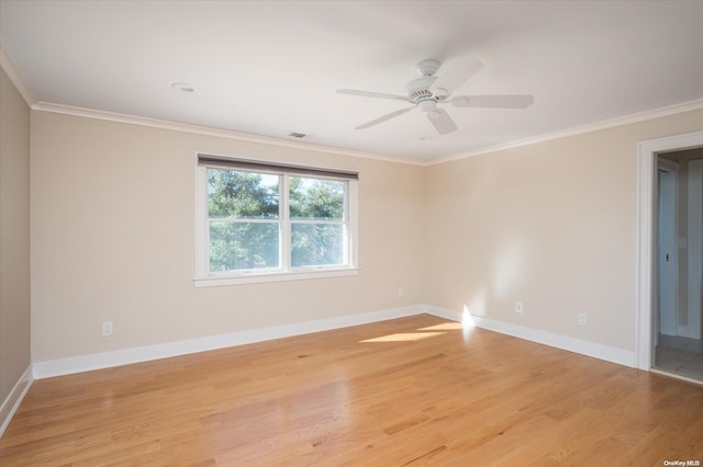 spare room with light hardwood / wood-style flooring, ceiling fan, and crown molding