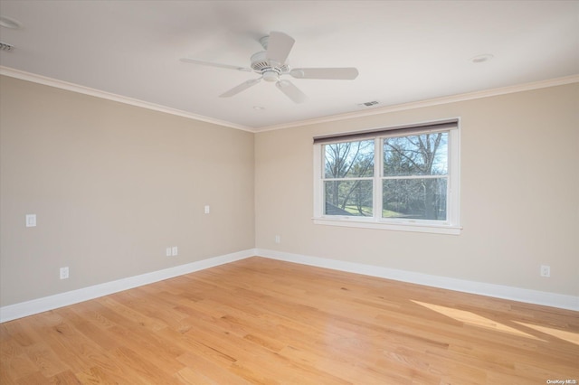 unfurnished room featuring crown molding, light hardwood / wood-style flooring, and ceiling fan