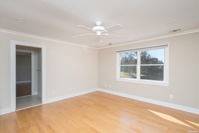 unfurnished room featuring light hardwood / wood-style flooring, ceiling fan, and crown molding