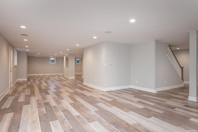 spare room featuring light hardwood / wood-style flooring