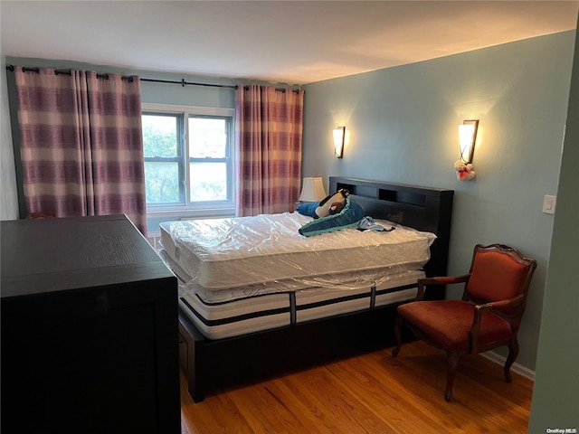 bedroom featuring hardwood / wood-style flooring