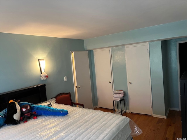 bedroom featuring hardwood / wood-style floors