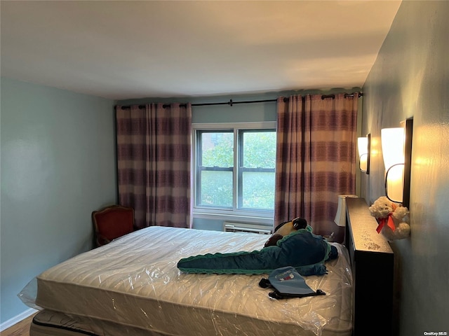 bedroom featuring hardwood / wood-style floors