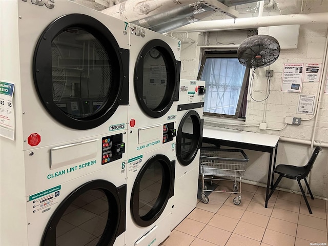 laundry area featuring washing machine and clothes dryer and stacked washer and clothes dryer