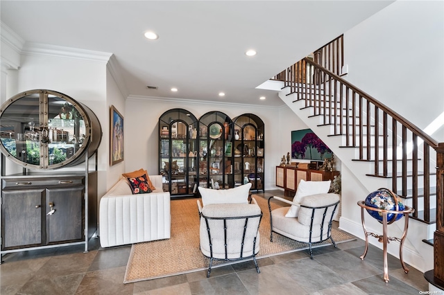 living area featuring crown molding