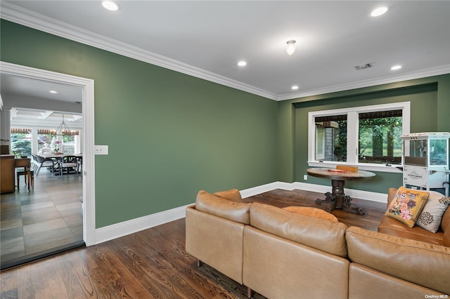 living room with dark hardwood / wood-style floors and crown molding