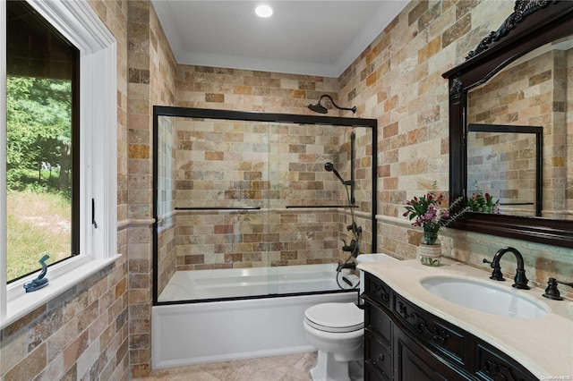 full bathroom with vanity, toilet, and enclosed tub / shower combo