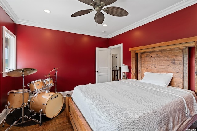 bedroom with ceiling fan, dark wood-type flooring, and ornamental molding