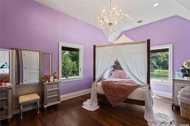 bedroom with a notable chandelier, dark hardwood / wood-style flooring, and vaulted ceiling