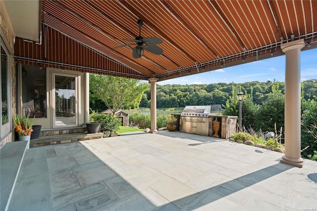 view of patio featuring grilling area, ceiling fan, and exterior kitchen