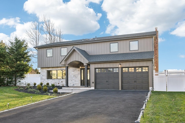 8 Shoal Dr, West Islip, NY 11795 - view of front of home featuring asphalt driveway, a shingled roof, and an attached garage