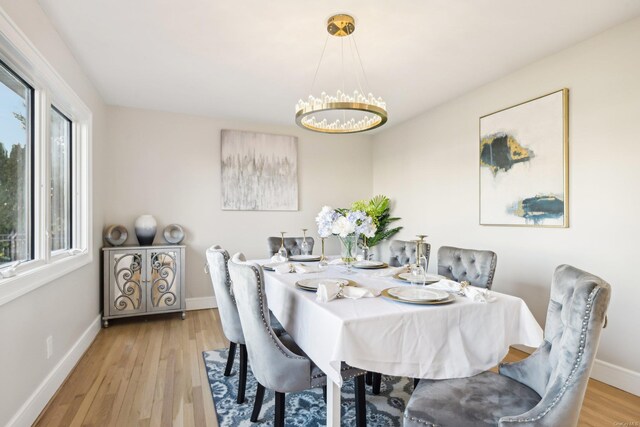 8 Shoal Dr, West Islip, NY 11795 - dining area with a chandelier and wood finished floors