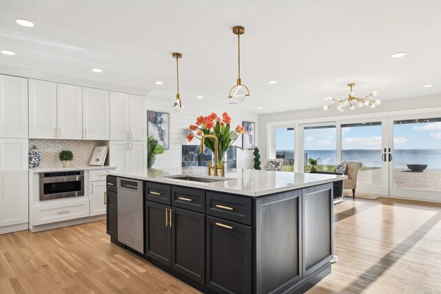 8 Shoal Dr, West Islip, NY 11795 - kitchen with white cabinetry, hanging light fixtures, a chandelier, light wood-style floors, and recessed lighting