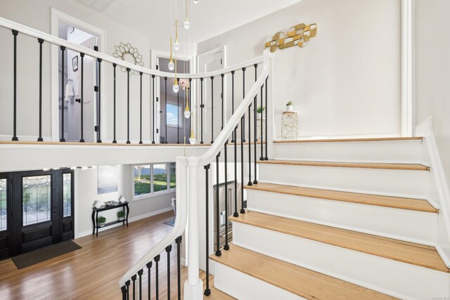 8 Shoal Dr, West Islip, NY 11795 - staircase featuring wood finished floors and baseboards