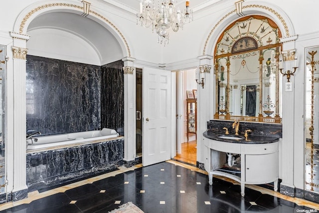 bathroom featuring vanity, a relaxing tiled tub, and ornamental molding