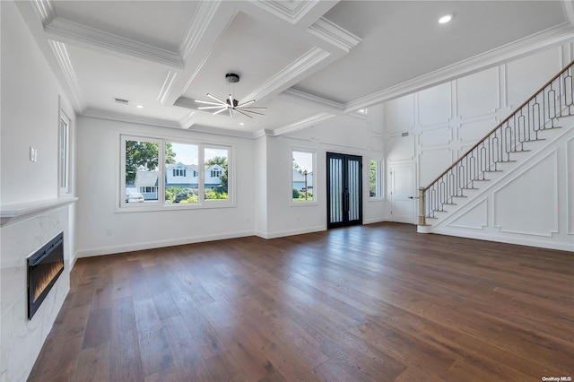 unfurnished living room with crown molding, coffered ceiling, ceiling fan, and dark hardwood / wood-style floors