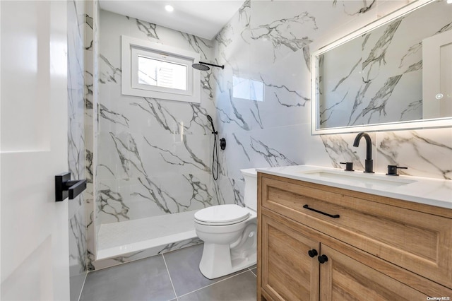 bathroom featuring a tile shower, tasteful backsplash, tile patterned floors, toilet, and vanity