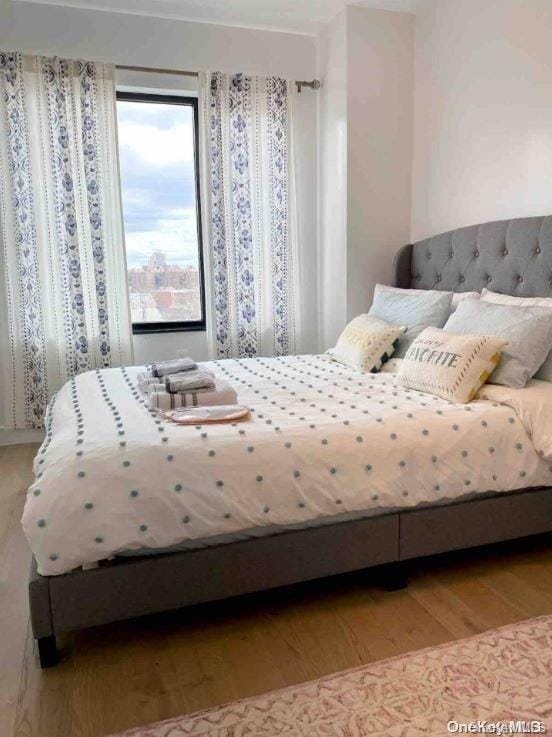 bedroom with light wood-type flooring