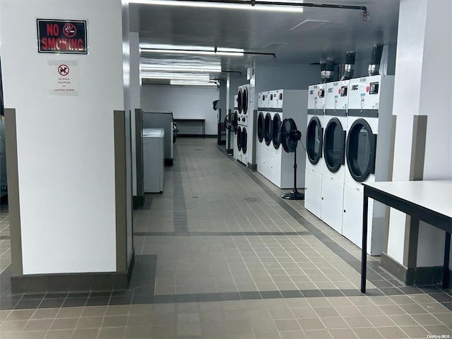 washroom with tile patterned floors and independent washer and dryer