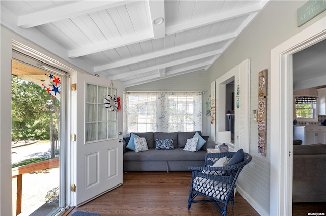 sunroom / solarium with vaulted ceiling with beams