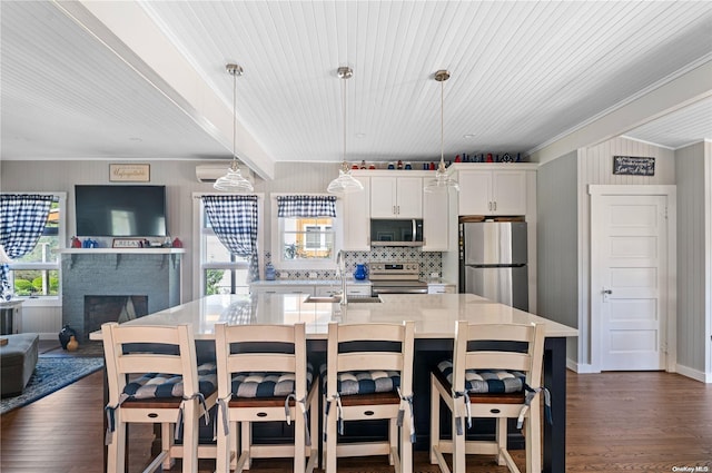 29 Ocean Rd, Ocean Beach, NY 11770 - kitchen featuring dark hardwood / wood-style flooring, stainless steel appliances, a healthy amount of sunlight, and sink