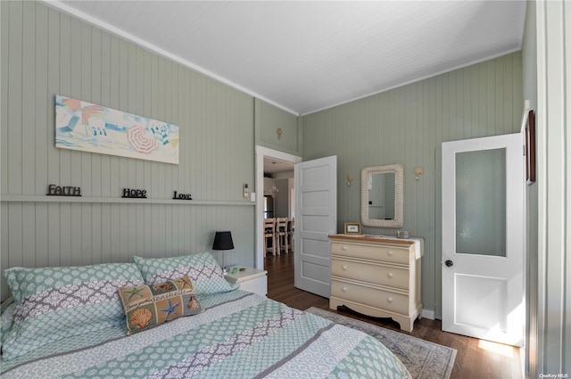 29 Ocean Rd, Ocean Beach, NY 11770 - bedroom featuring dark hardwood / wood-style floors, crown molding, and wooden walls