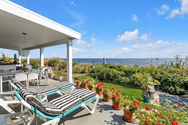 view of patio with a water view