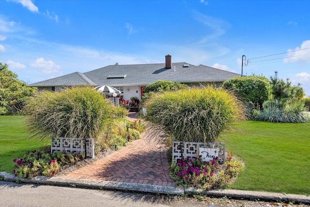 view of home's exterior with a yard