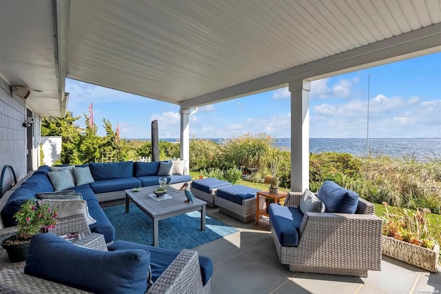 view of patio featuring an outdoor living space and a water view