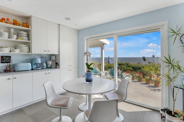 dining space featuring light tile patterned floors