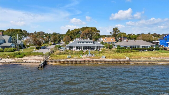 back of property with a water view