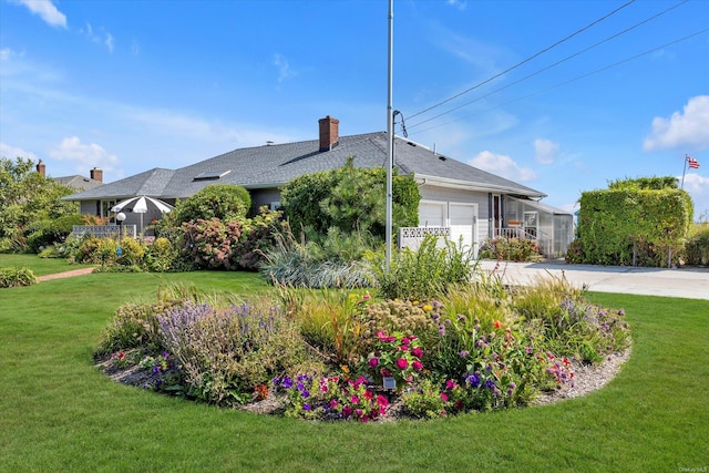 view of property exterior featuring a garage and a lawn