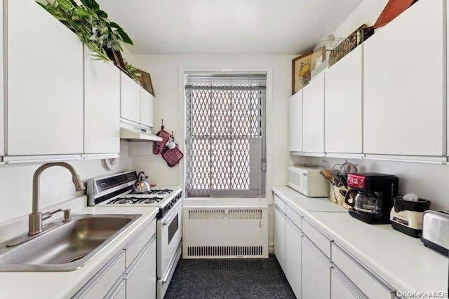 kitchen with white cabinetry, sink, white appliances, and radiator heating unit