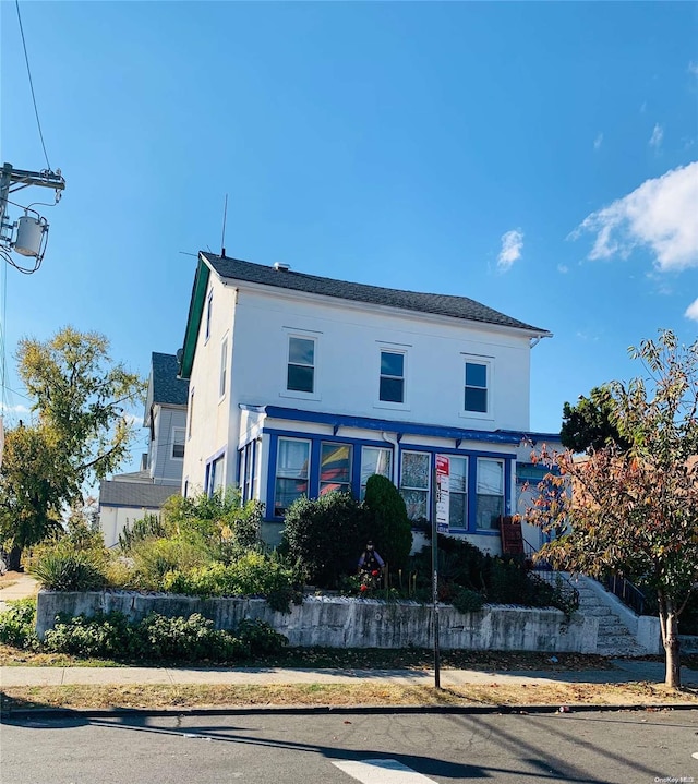 12-28 150th St, Whitestone, NY 11357 - view of front of property with stucco siding
