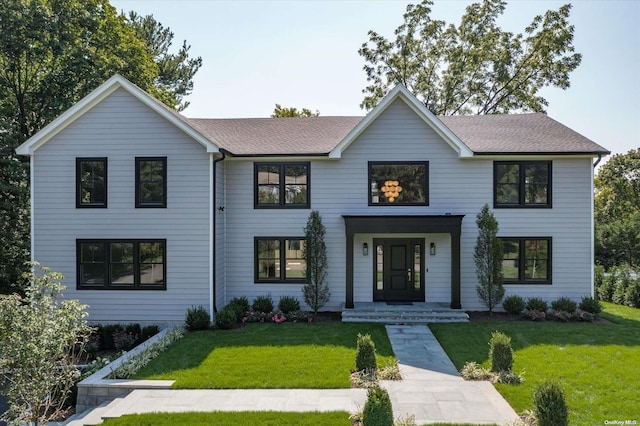 view of front of home with a front lawn