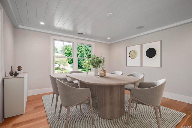 dining area featuring light hardwood / wood-style floors and wooden ceiling